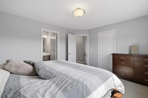 64 Henderson Crescent, Penhold, AB - Indoor Photo Showing Bedroom