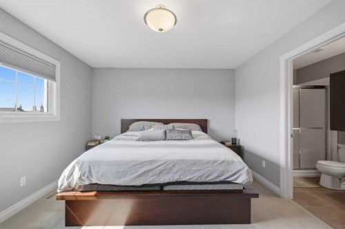 64 Henderson Crescent, Penhold, AB - Indoor Photo Showing Bedroom