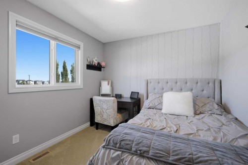 64 Henderson Crescent, Penhold, AB - Indoor Photo Showing Bedroom