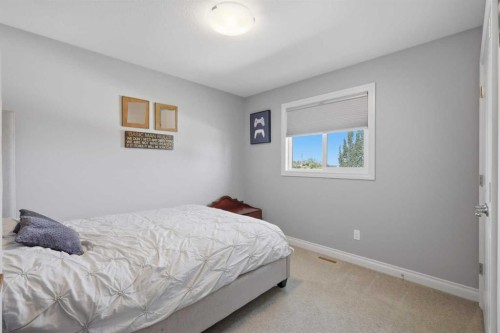 64 Henderson Crescent, Penhold, AB - Indoor Photo Showing Bedroom