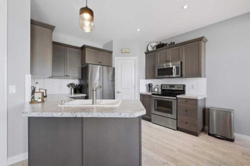 64 Henderson Crescent, Penhold, AB - Indoor Photo Showing Kitchen