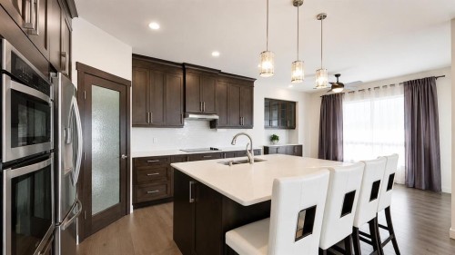 78 Cranarch View Se, Calgary, AB - Indoor Photo Showing Kitchen With Double Sink With Upgraded Kitchen