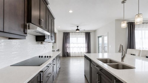 78 Cranarch View Se, Calgary, AB - Indoor Photo Showing Kitchen With Double Sink With Upgraded Kitchen