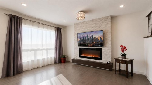78 Cranarch View Se, Calgary, AB - Indoor Photo Showing Living Room With Fireplace