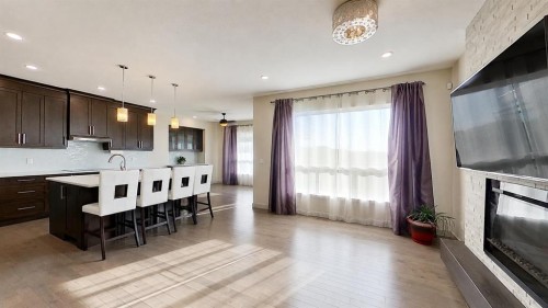 78 Cranarch View Se, Calgary, AB - Indoor Photo Showing Kitchen With Fireplace