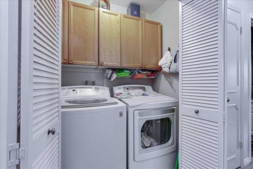 11 West Heights Drive, Didsbury, AB - Indoor Photo Showing Laundry Room