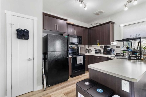 8 Sullivan, Red Deer, AB - Indoor Photo Showing Kitchen With Double Sink