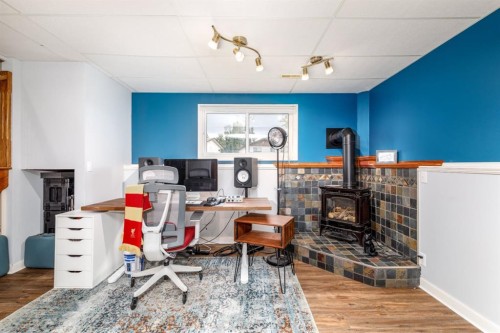 60 Gehrke Close, Red Deer, AB - Indoor Photo Showing Office With Fireplace