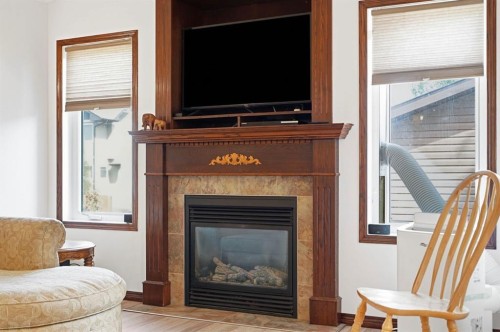 148 Vickers Close, Red Deer, AB - Indoor Photo Showing Living Room With Fireplace