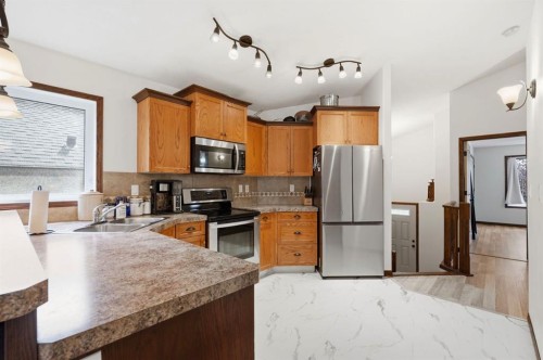148 Vickers Close, Red Deer, AB - Indoor Photo Showing Kitchen With Double Sink