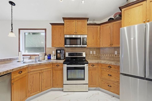 148 Vickers Close, Red Deer, AB - Indoor Photo Showing Kitchen With Double Sink