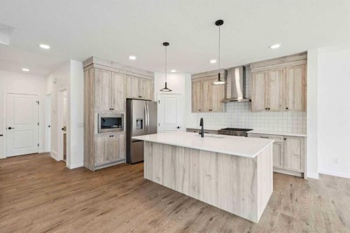 1030 Bayview Crescent Sw, Airdrie, AB - Indoor Photo Showing Kitchen With Double Sink With Upgraded Kitchen