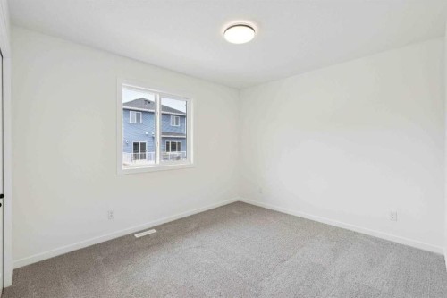 1030 Bayview Crescent Sw, Airdrie, AB - Indoor Photo Showing Other Room