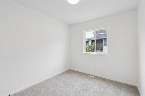 1030 Bayview Crescent Sw, Airdrie, AB - Indoor Photo Showing Other Room