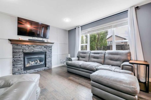 210 Viscount Drive, Red Deer, AB - Indoor Photo Showing Living Room With Fireplace