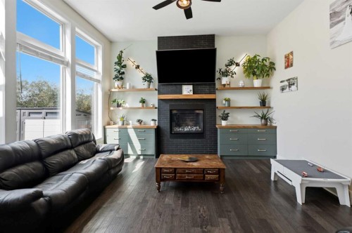 35 Erica Drive, Lacombe, AB - Indoor Photo Showing Living Room With Fireplace