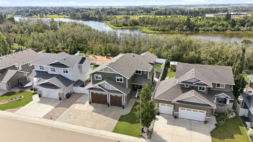 35 Erica Drive, Lacombe, AB - Outdoor With Body Of Water With Facade