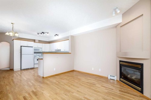 105-4512 52 Avenue, Red Deer, AB - Indoor Photo Showing Other Room With Fireplace