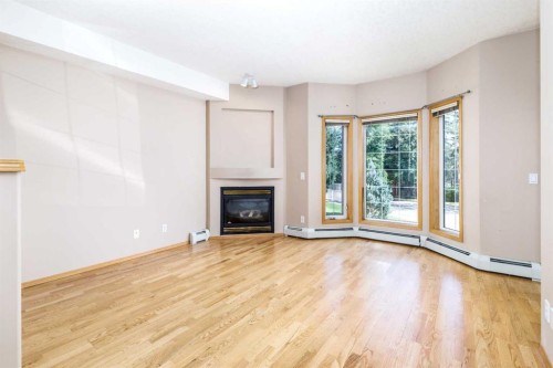 105-4512 52 Avenue, Red Deer, AB - Indoor Photo Showing Other Room With Fireplace