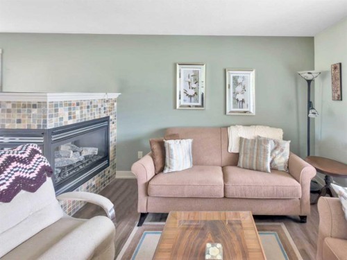 128 12 Ave Ne, Sundre, AB - Indoor Photo Showing Living Room With Fireplace