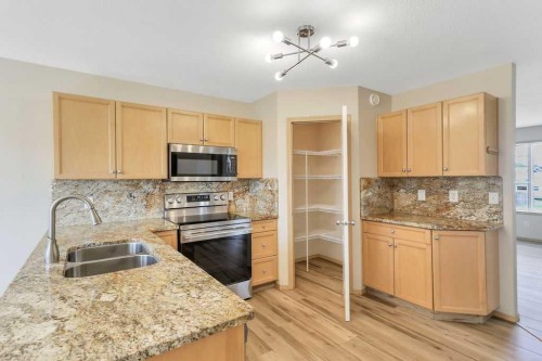 102 Drummond Avenue, Red Deer, AB - Indoor Photo Showing Kitchen With Stainless Steel Kitchen With Double Sink