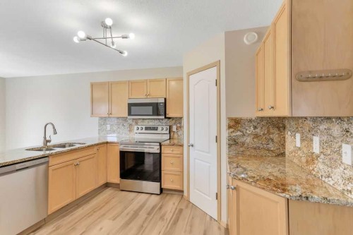 102 Drummond Avenue, Red Deer, AB - Indoor Photo Showing Kitchen With Stainless Steel Kitchen With Double Sink