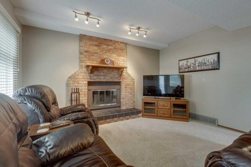 6 Ramsey Avenue, Red Deer, AB - Indoor Photo Showing Living Room With Fireplace