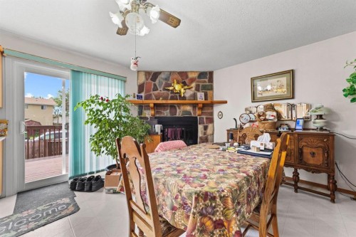6209 34 Avenue, Camrose, AB - Indoor Photo Showing Dining Room With Fireplace