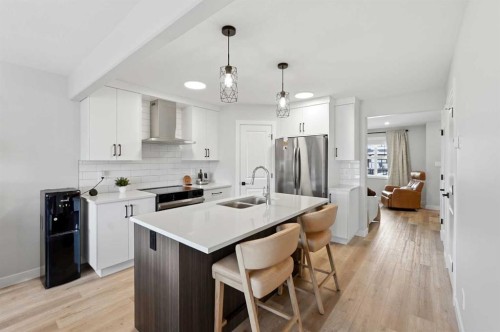 254 Halifax Close, Penhold, AB - Indoor Photo Showing Kitchen With Double Sink With Upgraded Kitchen