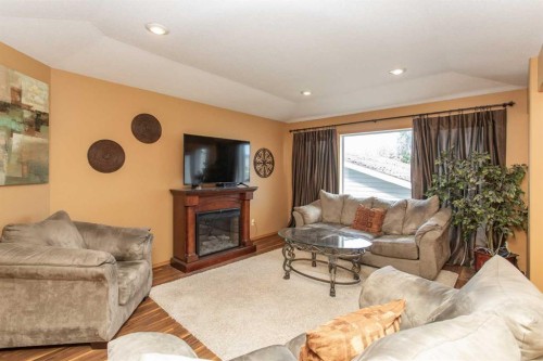 717 Lancaster Drive, Red Deer, AB - Indoor Photo Showing Living Room With Fireplace