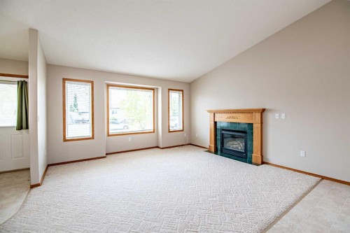 19 Fulmar Close, Sylvan Lake, AB - Indoor With Fireplace