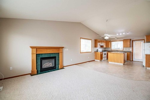 19 Fulmar Close, Sylvan Lake, AB - Indoor Photo Showing Living Room With Fireplace