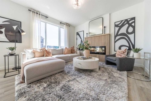 381 Sora Park Se, Calgary, AB - Indoor Photo Showing Living Room With Fireplace