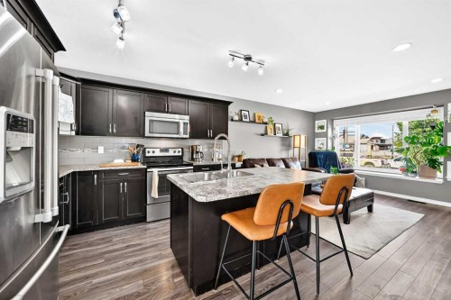 31 Crestview Boulevard, Sylvan Lake, AB - Indoor Photo Showing Kitchen With Double Sink With Upgraded Kitchen