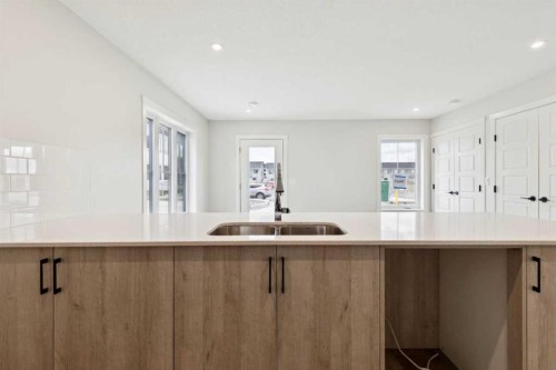 1201-350 Mahogany Parade Se, Calgary, AB - Indoor Photo Showing Kitchen With Double Sink