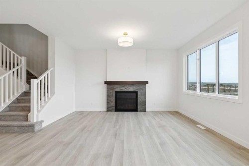 139 Fireside Close, Cochrane, AB - Indoor Photo Showing Living Room With Fireplace