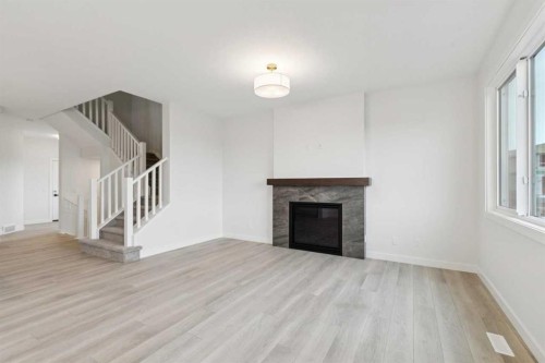 139 Fireside Close, Cochrane, AB - Indoor Photo Showing Living Room With Fireplace