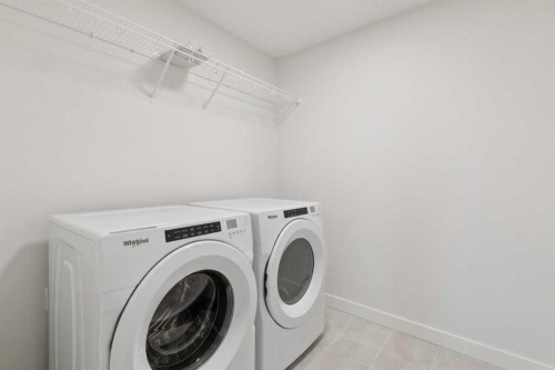 139 Fireside Close, Cochrane, AB - Indoor Photo Showing Laundry Room