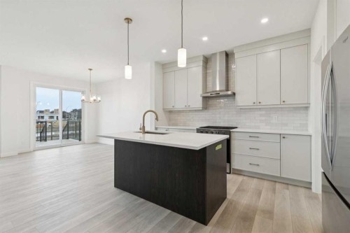 139 Fireside Close, Cochrane, AB - Indoor Photo Showing Kitchen With Upgraded Kitchen