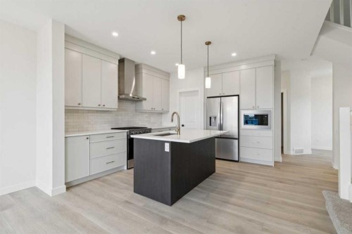 139 Fireside Close, Cochrane, AB - Indoor Photo Showing Kitchen With Upgraded Kitchen