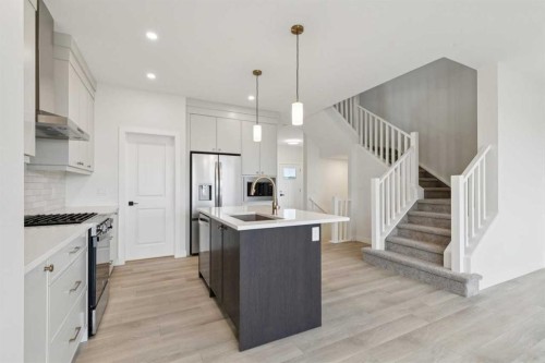 139 Fireside Close, Cochrane, AB - Indoor Photo Showing Kitchen With Upgraded Kitchen