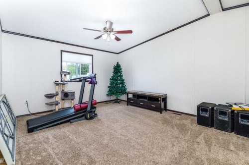4705 45 Avenue, Alix, AB - Indoor Photo Showing Gym Room