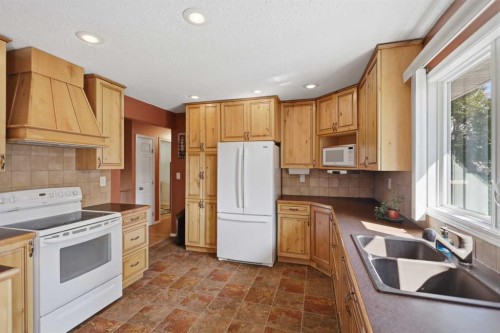 7 Halman Crescent, Red Deer, AB - Indoor Photo Showing Kitchen With Double Sink