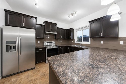 36 Tanner Street, Red Deer, AB - Indoor Photo Showing Kitchen With Stainless Steel Kitchen With Double Sink With Upgraded Kitchen