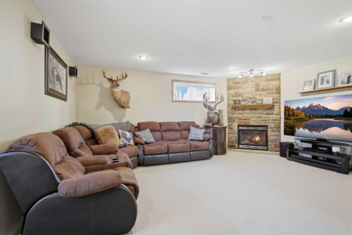 16 Filbert Close, Sylvan Lake, AB - Indoor Photo Showing Living Room With Fireplace