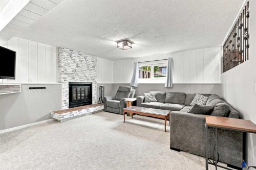 62 Rupert Crescent, Red Deer, AB - Indoor Photo Showing Living Room With Fireplace