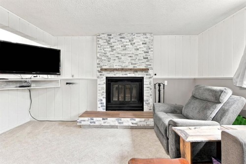 62 Rupert Crescent, Red Deer, AB - Indoor Photo Showing Living Room With Fireplace