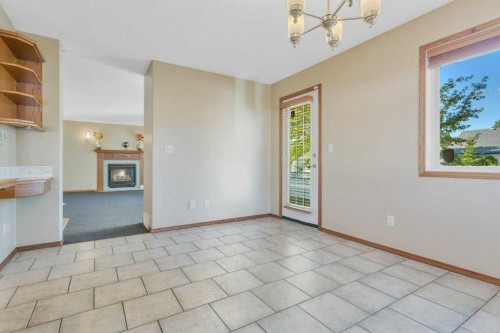 83 Lawrence Crescent, Red Deer, AB - Indoor Photo Showing Other Room With Fireplace