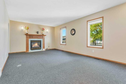 83 Lawrence Crescent, Red Deer, AB - Indoor Photo Showing Living Room With Fireplace