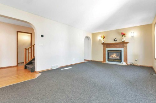 83 Lawrence Crescent, Red Deer, AB - Indoor Photo Showing Living Room With Fireplace